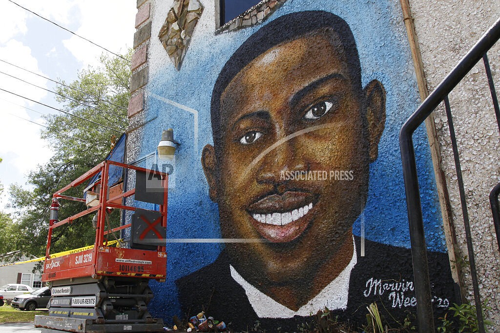 A painted mural of Ahmaud Arbery is displayed on May 17, 2020, in Brunswick, Ga., where the 25-year-old man was shot and killed in February. Arbery was shot and killed by two men who told police they thought he was a burglar. (AP Photo/Sarah Blake Morgan, file)