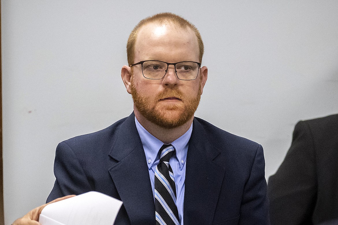 Travis McMichael listens to attorneys question a pool of prospective jurors during jury selection for the trial of he and his father Greg McMichael and William "Roddie" Bryan, at the Glynn County Courthouse, Monday, Oct. 25, 2021, in Brunswick, Ga. Travis McMichael, the man who fatally shot Ahmaud Arbery, was convicted of murder Wednesday, Nov. 24. The conviction carries a minimum sentence of life in prison (AP Photo/Stephen B. Morton, Pool, File)