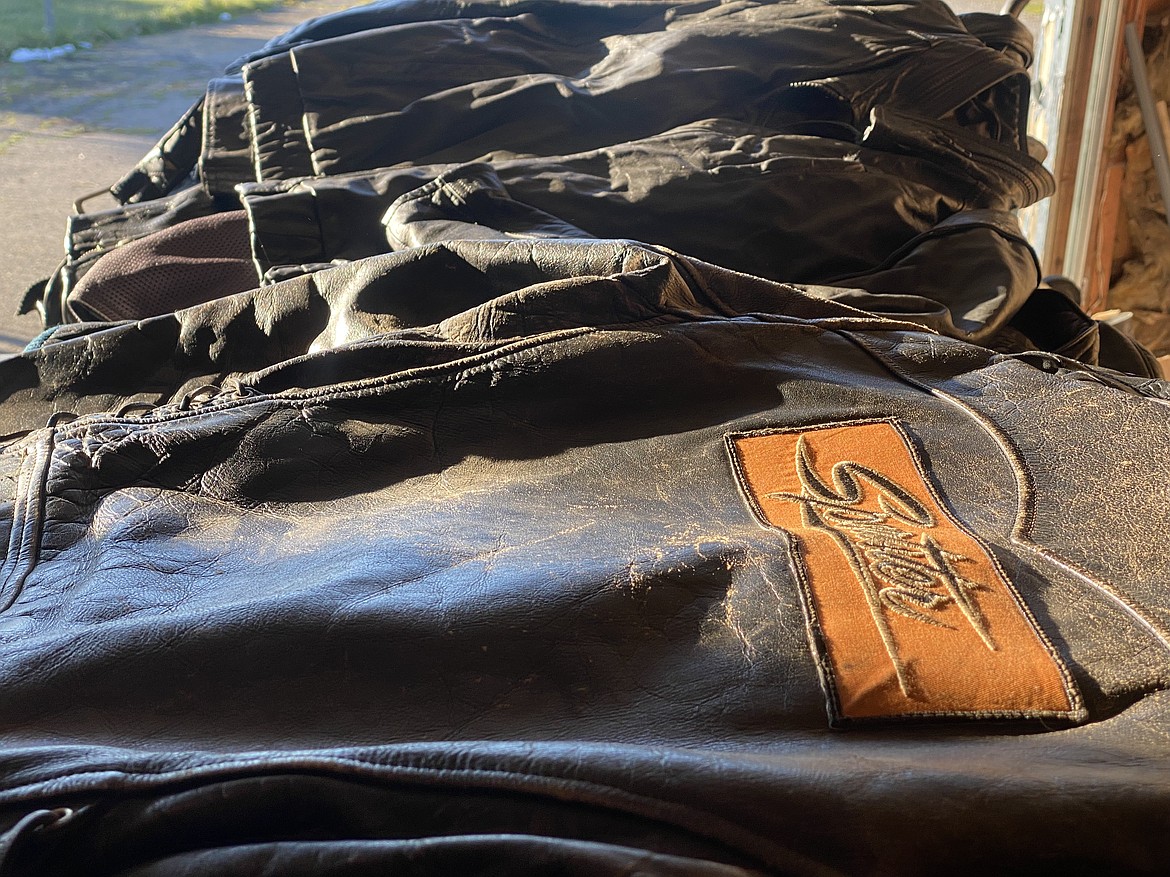 A pile of water buffalo hide jackets rests in the garage of Lee Gibson, a fifth-generation motorcyclist who lives in Rathdrum. (MADISON HARDY/Press)