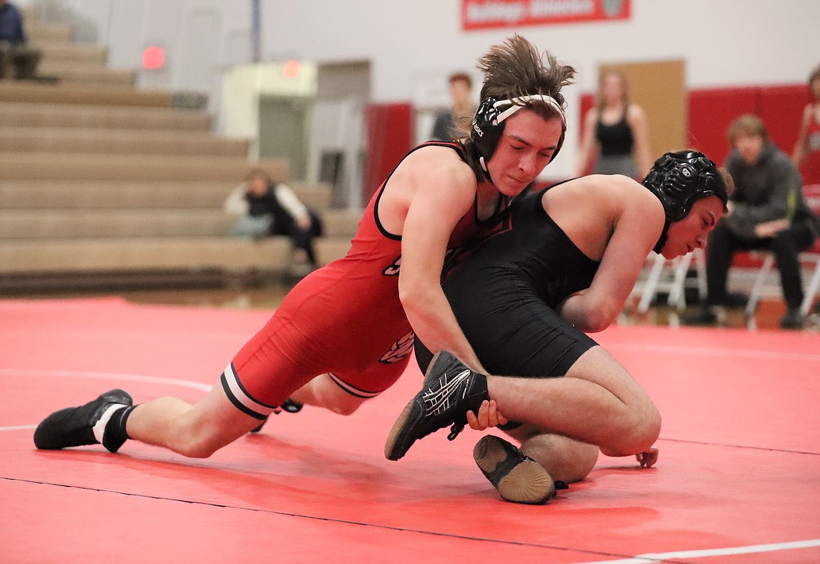 Ryker Akin (left) looks for a pin during a match Wednesday.