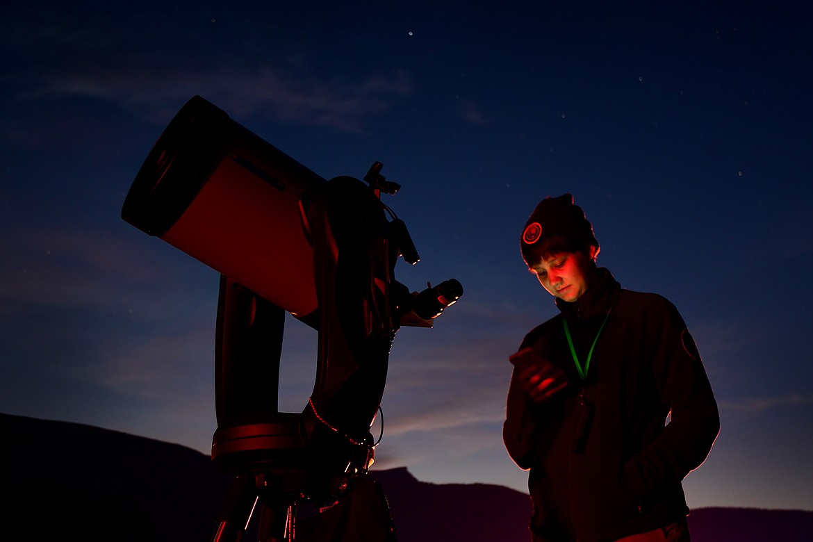 An intern sets up a telescope for visitors during the dedication of the Dusty Star Observatory at St. Mary in Glacier National Park in 2019. (Jeremy Weber/Daily Inter Lake)