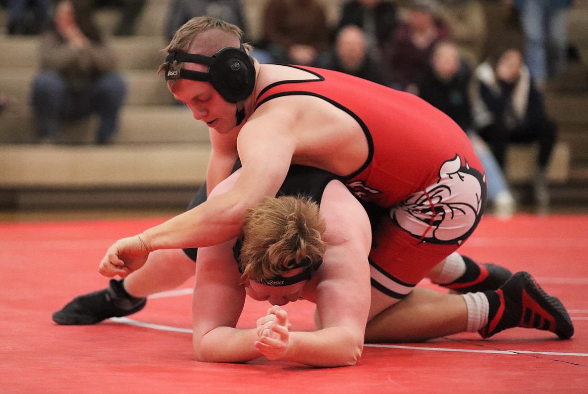 Austin Smith (red) gains control during a match Wednesday.