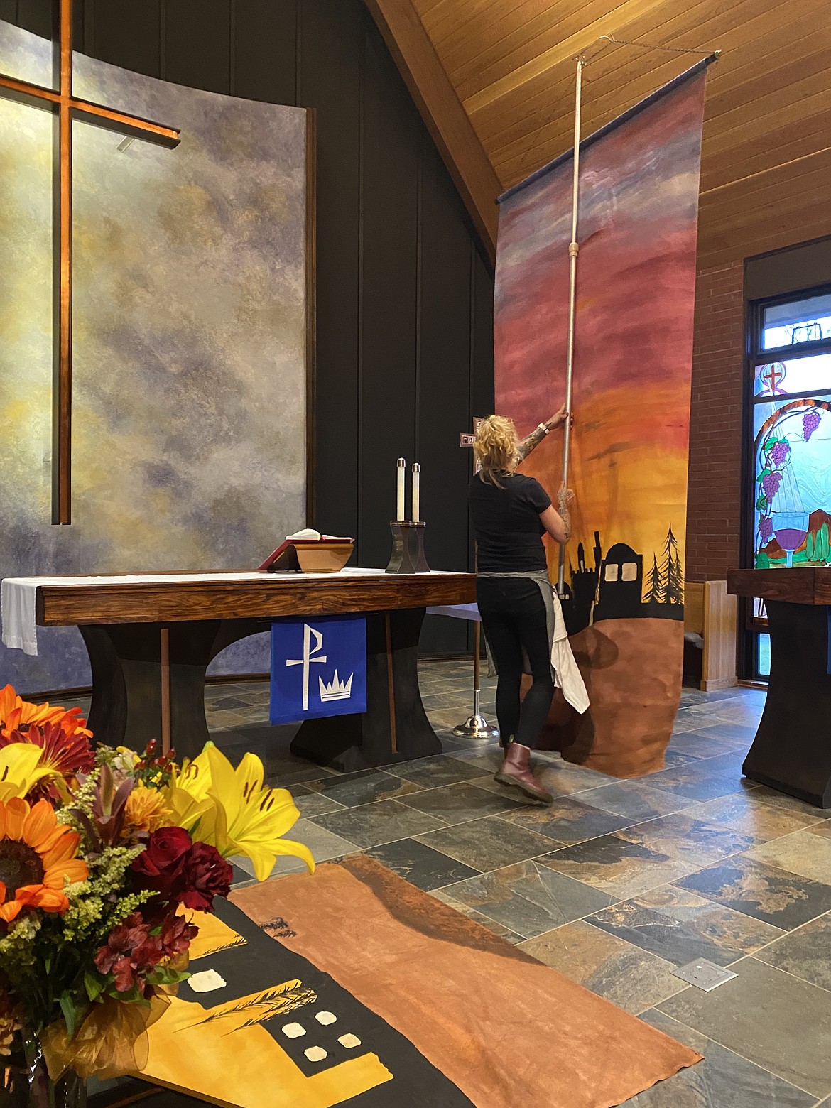Local artist, Shannon Erwin installs the enormous, hand-painted panels that mark the opening of the Advent season this Sunday.
