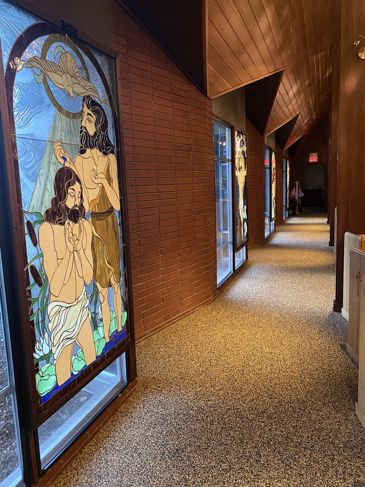 Stained-glass windows line a hallway within Trinity Lutheran Church on Fifth Street in Coeur d'Alene. Crafted by local artist Rebecca Ames Anderson, the windows join a host of impressive art pieces by local artists.