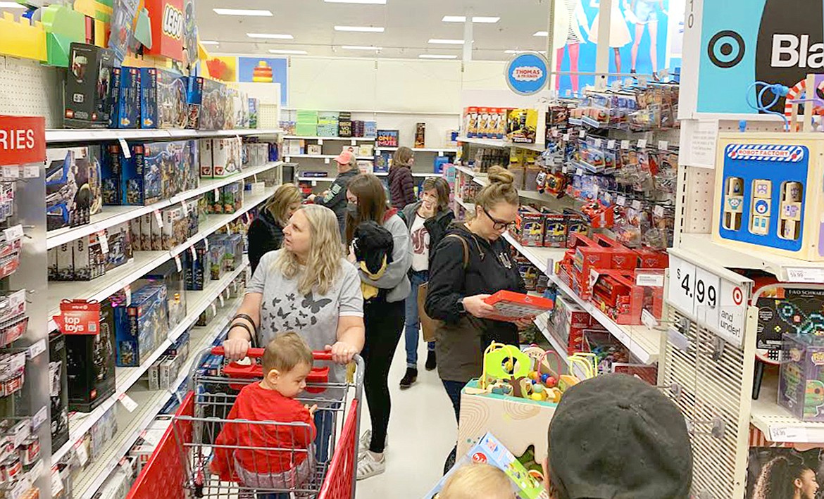 Shoppers crowd a toy aisle at Target on Friday.