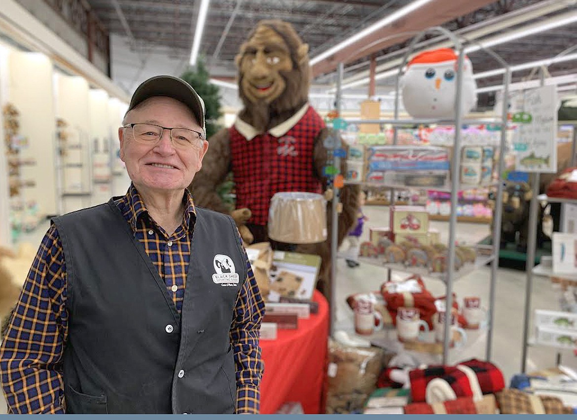 Darris Taylor greets guests at Black Friday Sporting Goods at the Silver Lake Mall on Friday.