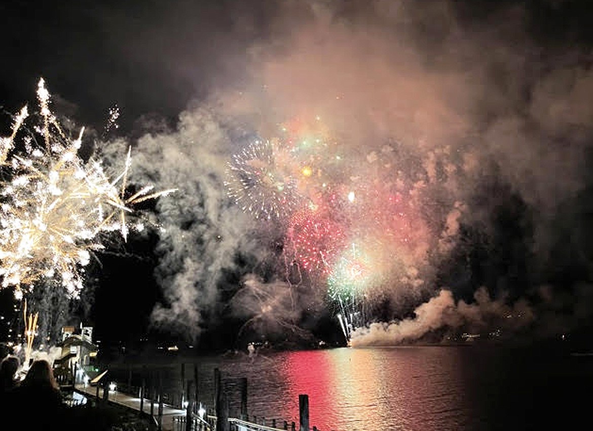 Photo by Clint Schroeder Fireworks explode over Lake Coeur d'Alene Friday night as part of The Coeur d'Alene Resort's lighting ceremony.