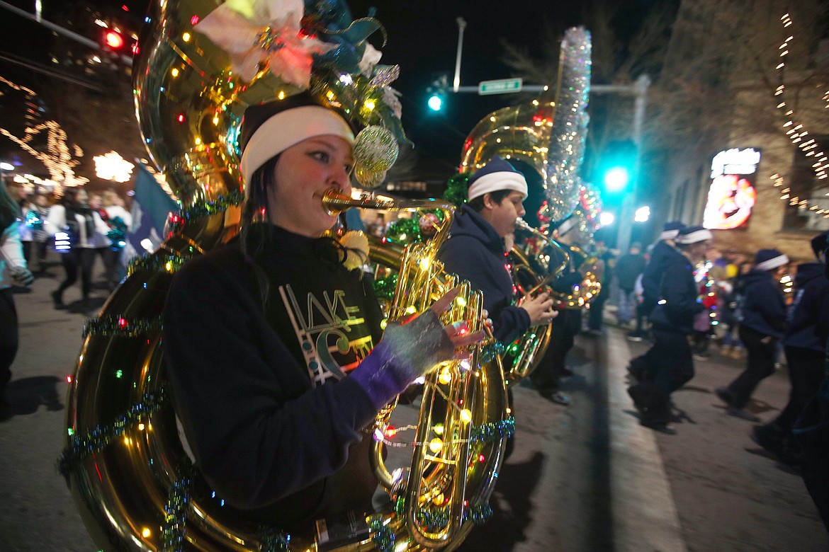 The Lake City High School band performs during the 29th annual Lighting Ceremony Parade on Sherman Avenue Friday night.