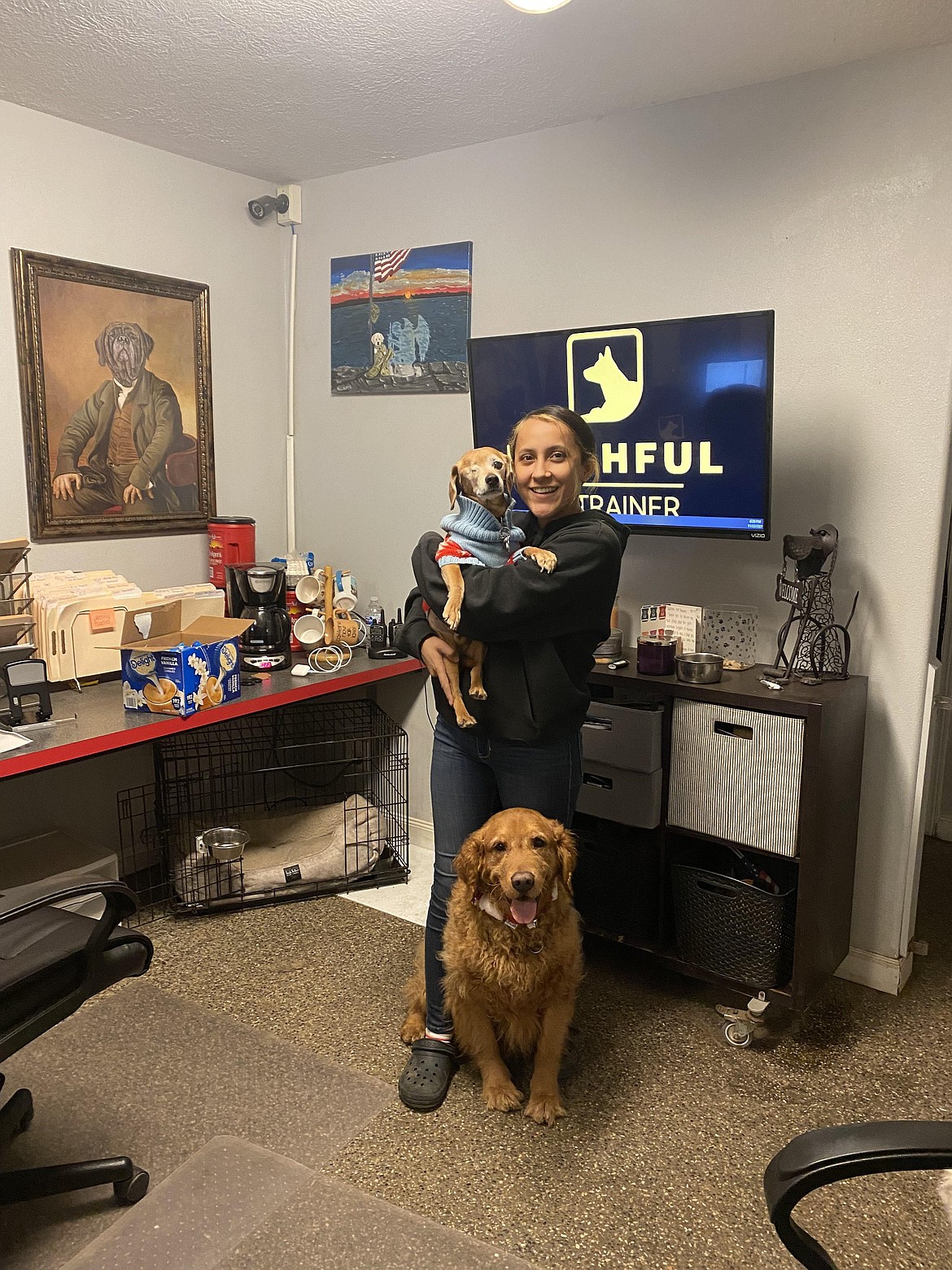 Office manager Mercy Alaniz with dog clients.