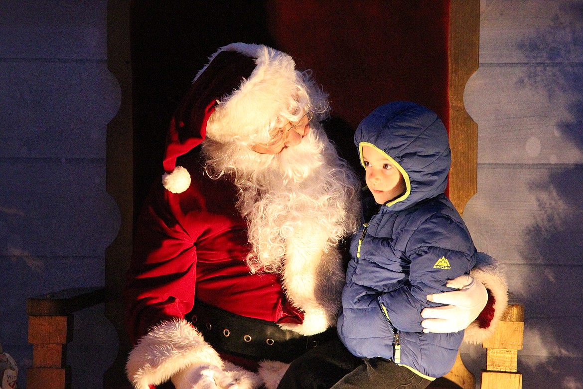 Santa Claus visited with children during a trip to Troy for the city's annual Christmas tree lighting on Nov. 27. (Will Langhorne/The Western News)