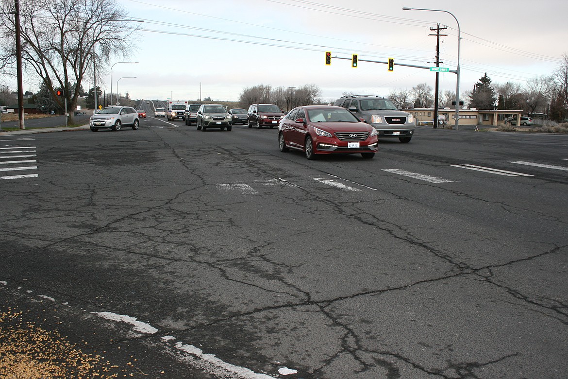 Vehicles roll through the intersection at Grape Drive and state Route 17.