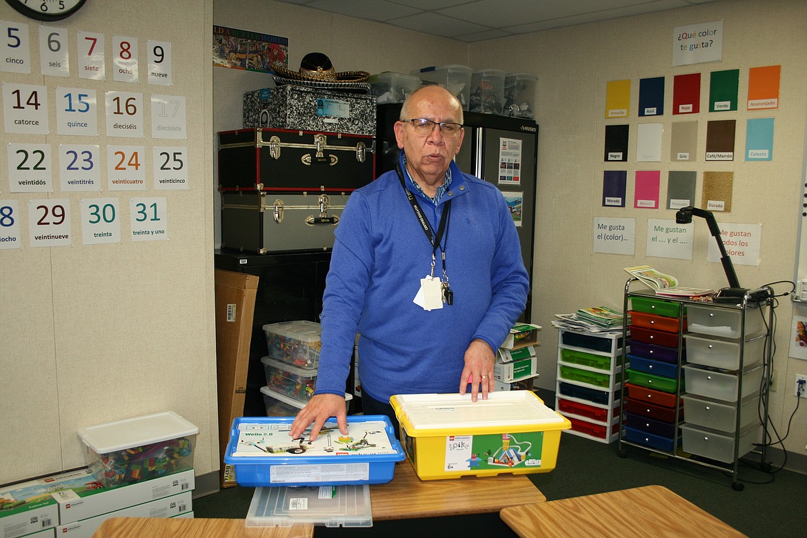 Mario Godoy Gonzalez displays the kits used by the robotics team at Red Rock Elementary School.