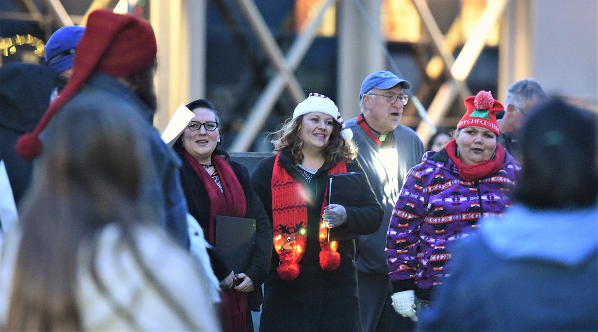 Members of the Mission Valley Choral Society serenaded the crowd gathered for the Christmas tree lighting Saturday night at the Lake County Courthouse. (Scot Heisel/Lake County Leader)