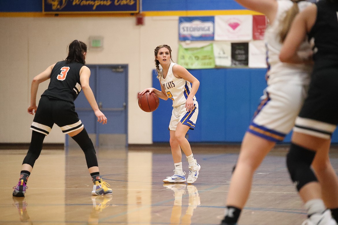 Clark Fork's Paige Valliere assesses the Priest River defense and looks to make a play.