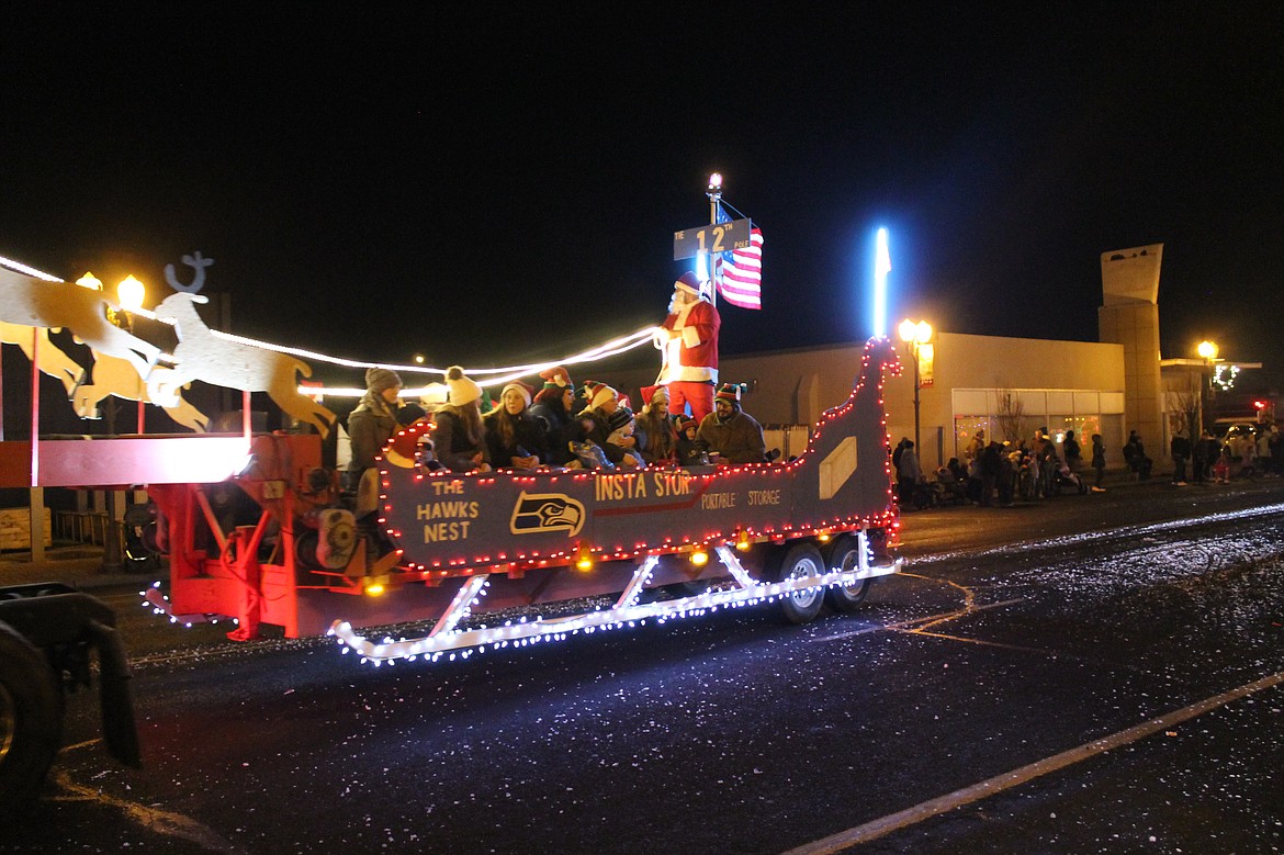 FLASHBACK: A float of Santa and some elves roll down the road in the 2019 Agricultural Parade.