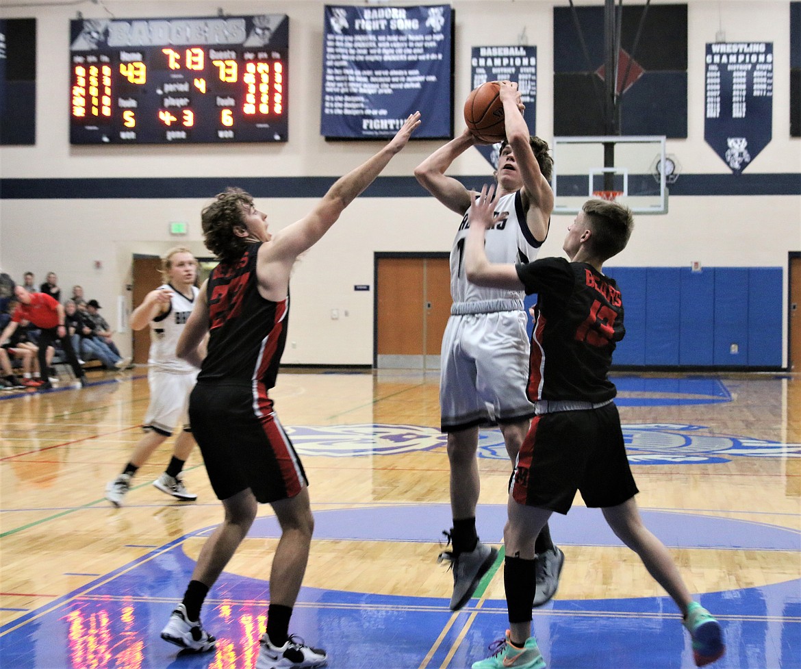 Charles Henslee shoots a jump shot over the Moscow defense at the Nov. 27 game.