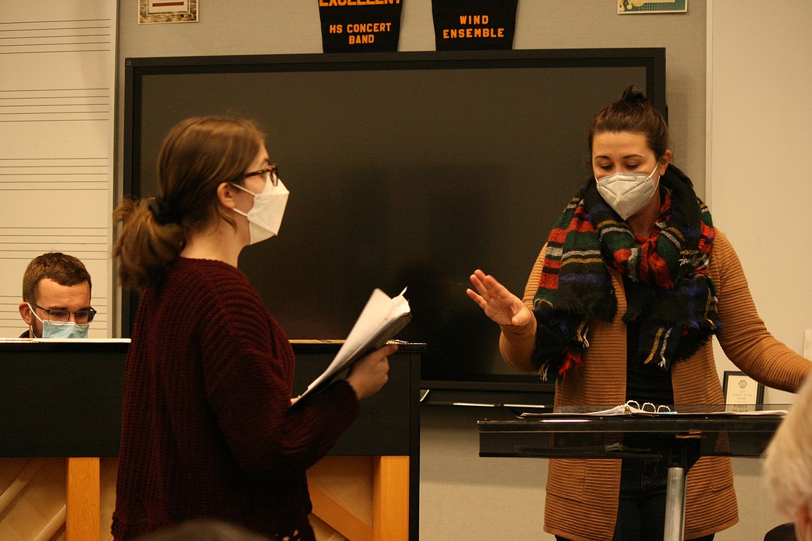 Quincy Valley Allied Arts community choir co-director Kylie Youngren, right, directs soloist Hailey Beegle during rehearsal Sunday for the QVAA Community Christmas Concert. Co-director Riley Youngren is at the piano.