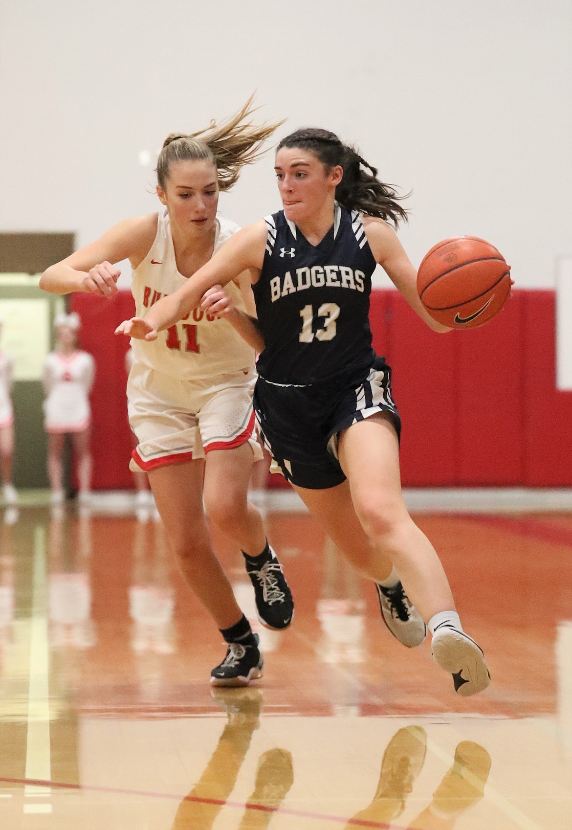 Junior Mia Blackmore (right) fends off Sandpoint's Tru Tomco while attempting to attack the basket during a game on Tuesday, Nov. 23 at Les Rogers Court.