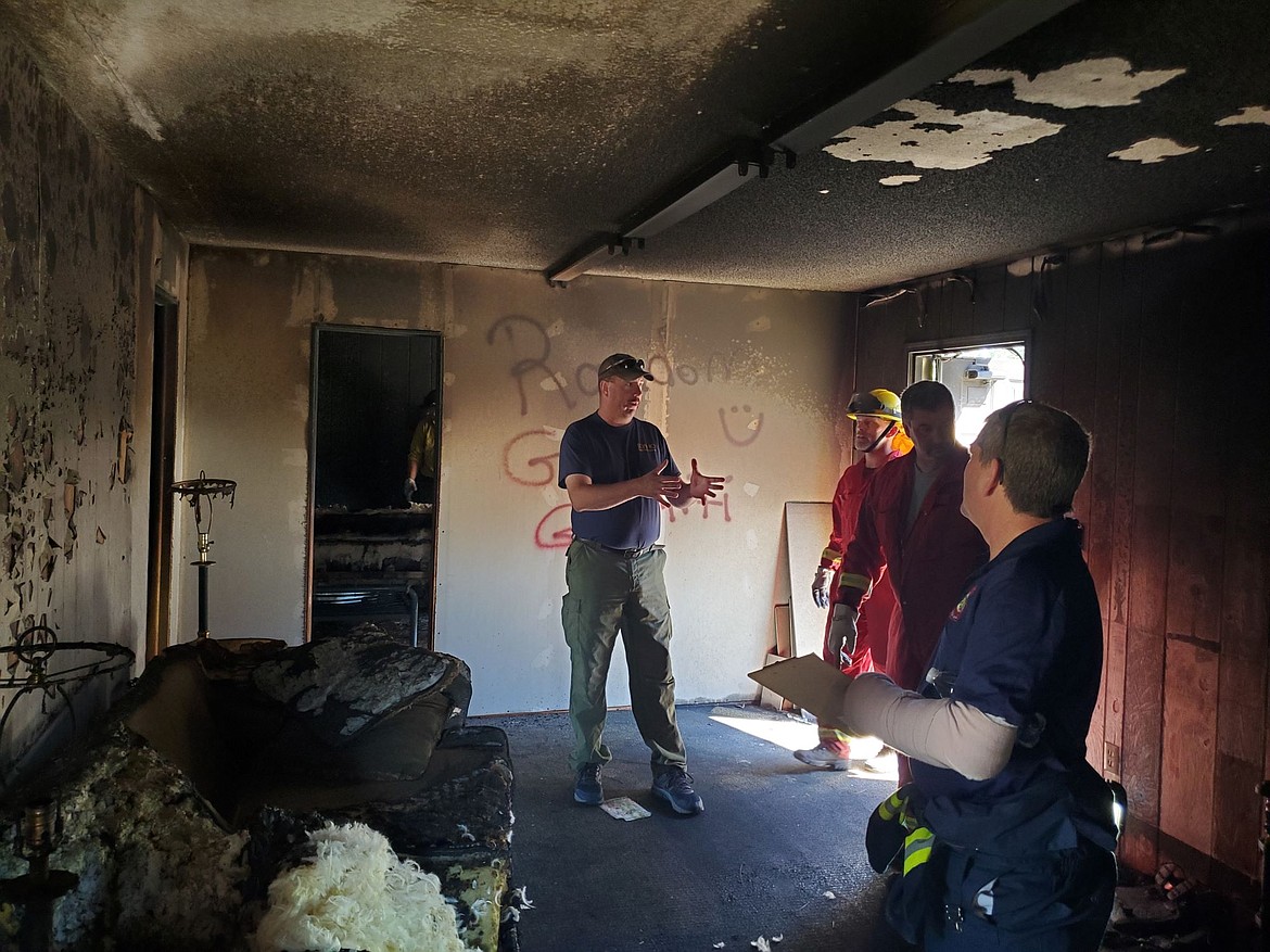 Members of South Boundary Fire District go through fire investigation training at the old Naples Elementary portable.