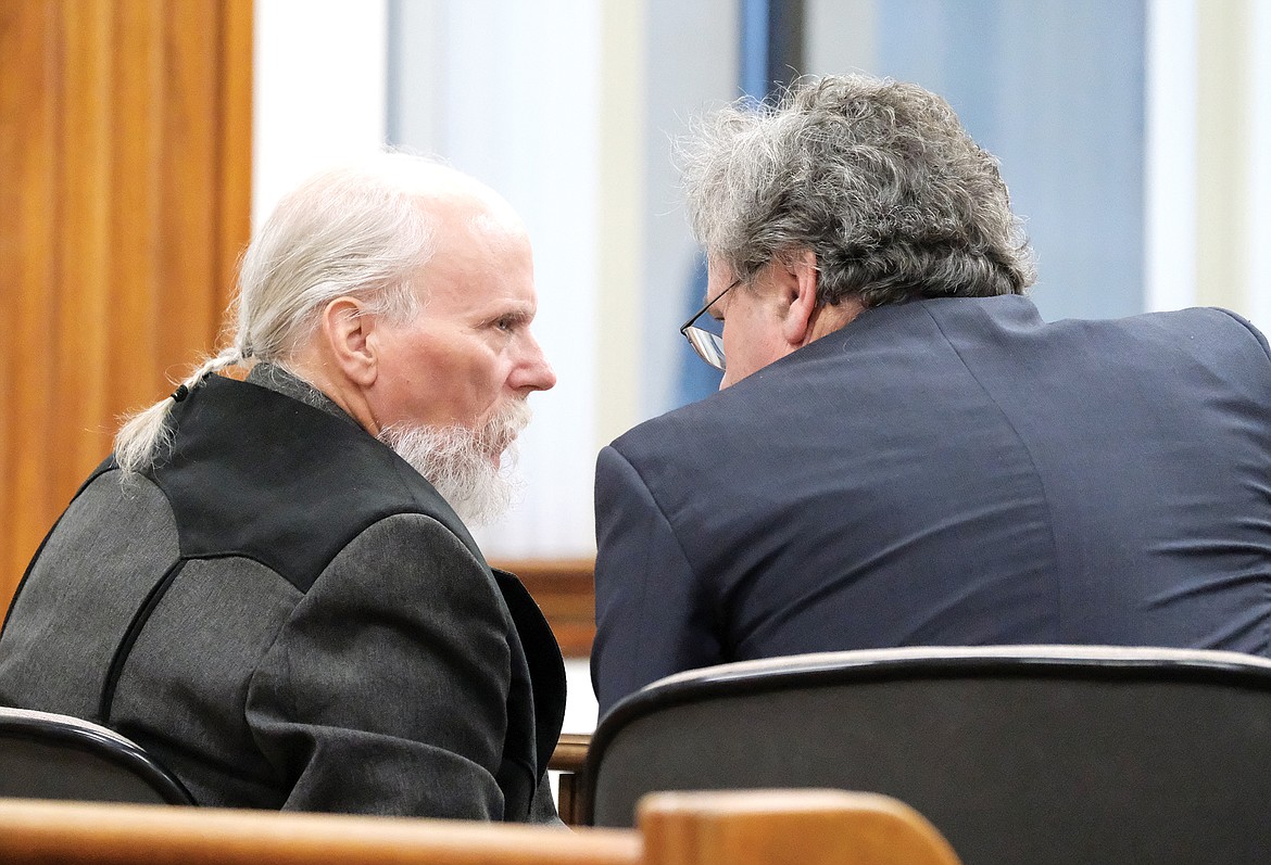Darrel "DC" Orr speaks with his attorney, Sean Hinchey, at his assault trial in Lincoln County District Court. (Paul Sievers/The Western News)