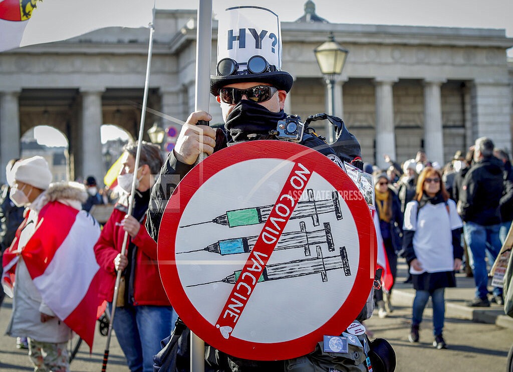 A man takes part in a demonstration against the country's coronavirus restrictions in Vienna, Austria, Saturday, Nov. 20, 2021. The coronavirus's omicron variant kept a jittery world off-kilter Wednesday Dec. 1, 2021, as reports of infections linked to the mutant strain cropped up in more parts of the globe, and one official said that the wait for more information on its dangers felt like “an eternity.” (AP Photo/Lisa Leutner, File)