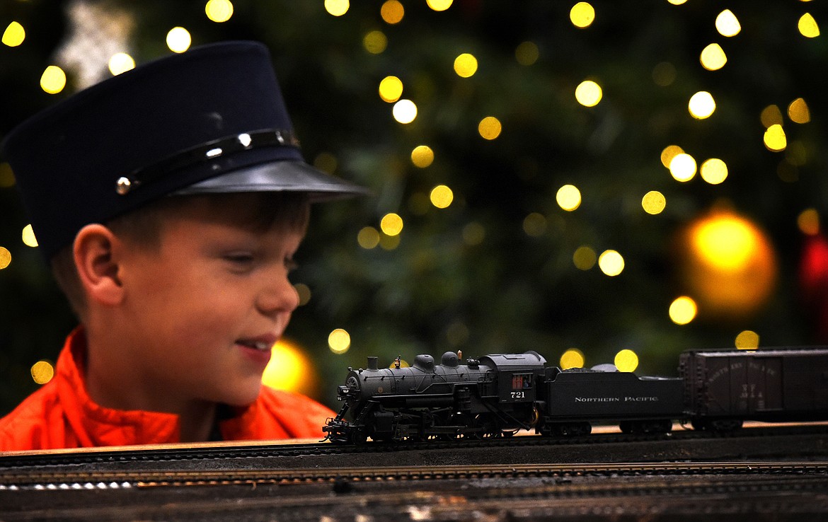 Wearing his conductor's hat, young Luke Sorensen takes in the model railroad display at the Kalispell Center Mall Saturday, November 27. (Jeremy Weber/Daily Inter Lake)