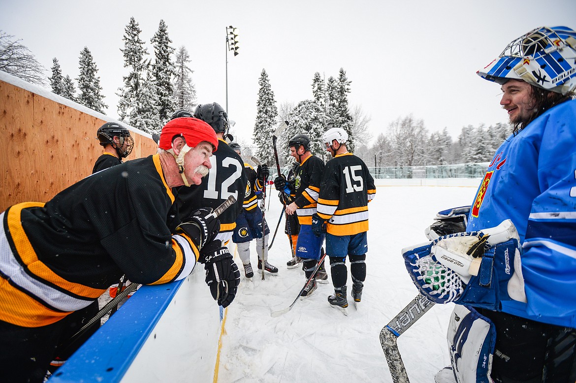 Tamarack Brewery's Lanny McDonald speaks with goalkeeper Ian Ferguson (34) during a break between periods against the Idaho North Tropics at the Craft Brewers Cup at Woodland Park Ice Center in Kalispell on Saturday, Dec. 4. (Casey Kreider/Daily Inter Lake)