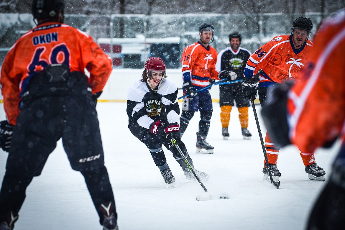 Tamarack Brewery's Calder Townsley (23) attacks the Idaho North Tropics defense at the Craft Brewers Cup at Woodland Park Ice Center in Kalispell on Saturday, Dec. 4. (Casey Kreider/Daily Inter Lake)