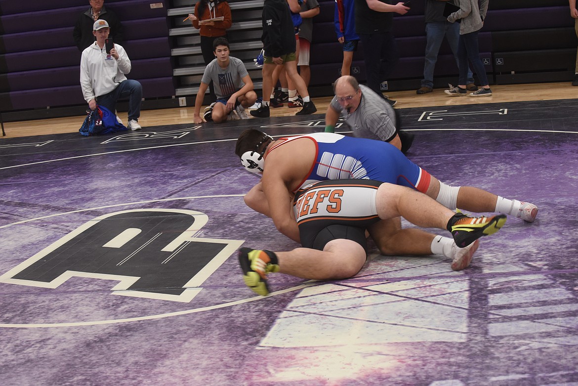 Superior’s Chandon Vulles turns Ronan’s Max Morency for a first-period pin Friday at the Owen Invitational in Polson. (Scott Shindledecker/Mineral Independent)