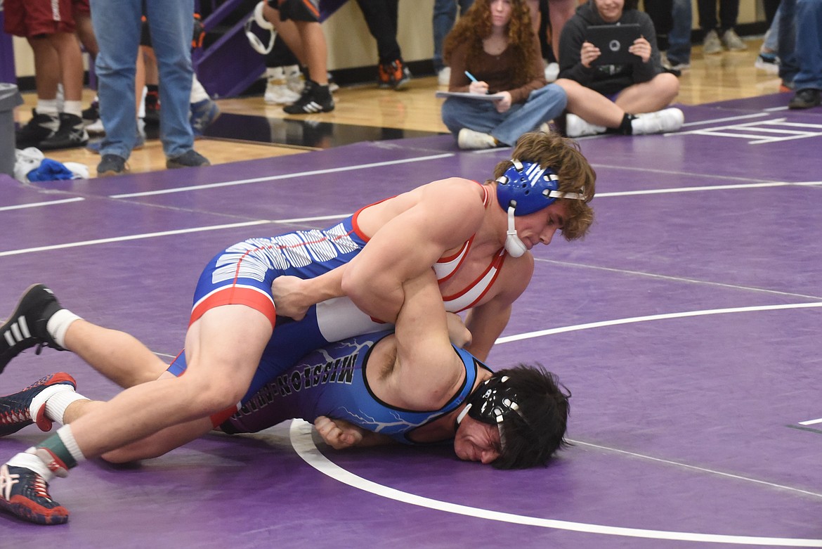Superior’s Silas Acker goes to work on Mission’s Deago Hostetler Friday at the Owen Invitational in Polson. Acker won by fall. (Scott Shindledecker/Mineral Independent)