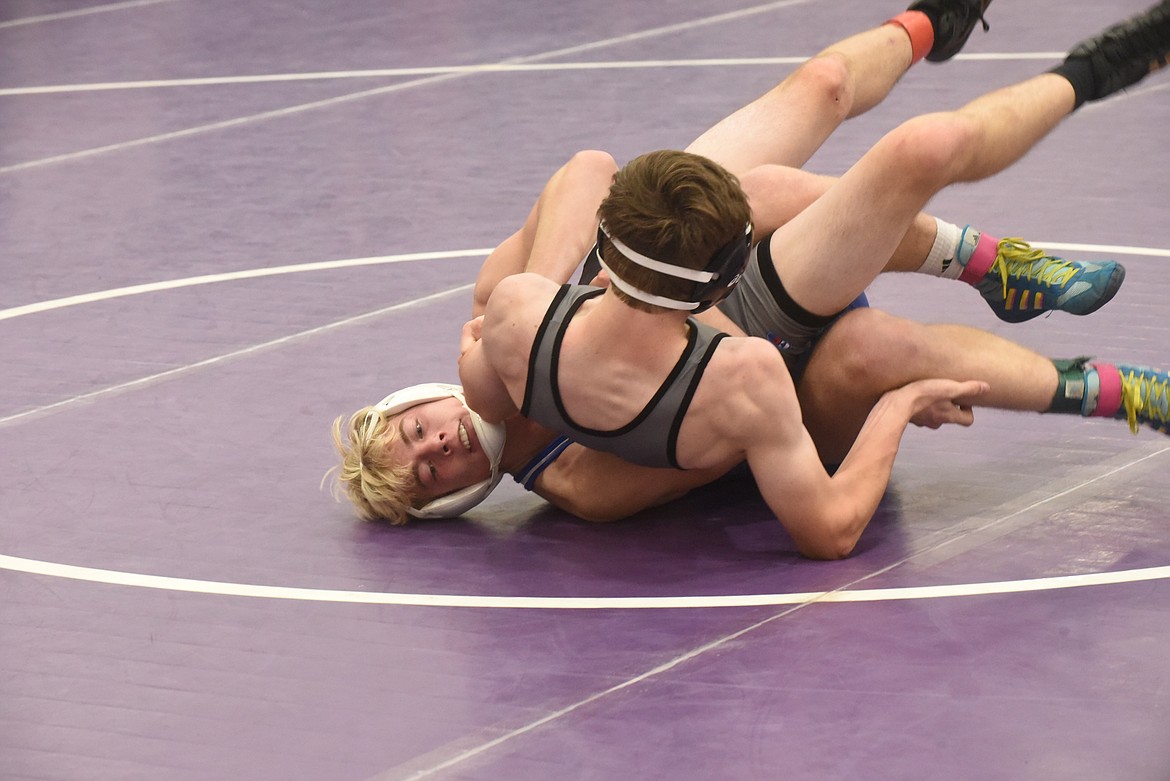 Thompson Falls’ Trae Thilmony takes Polson’s Noah Trosper to his back Friday at the Owen Invitational in Polson. Thilmony won by fall. (Scott Shindledecker/Valley Press)