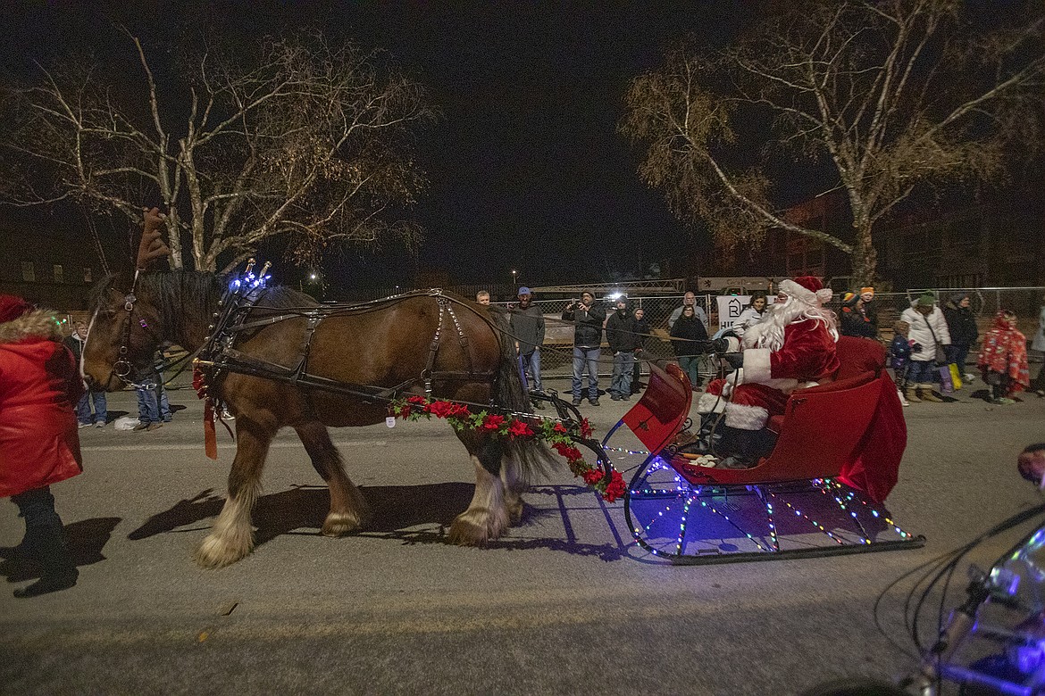 That has to be rough on the rails, as Santa slides down the road.