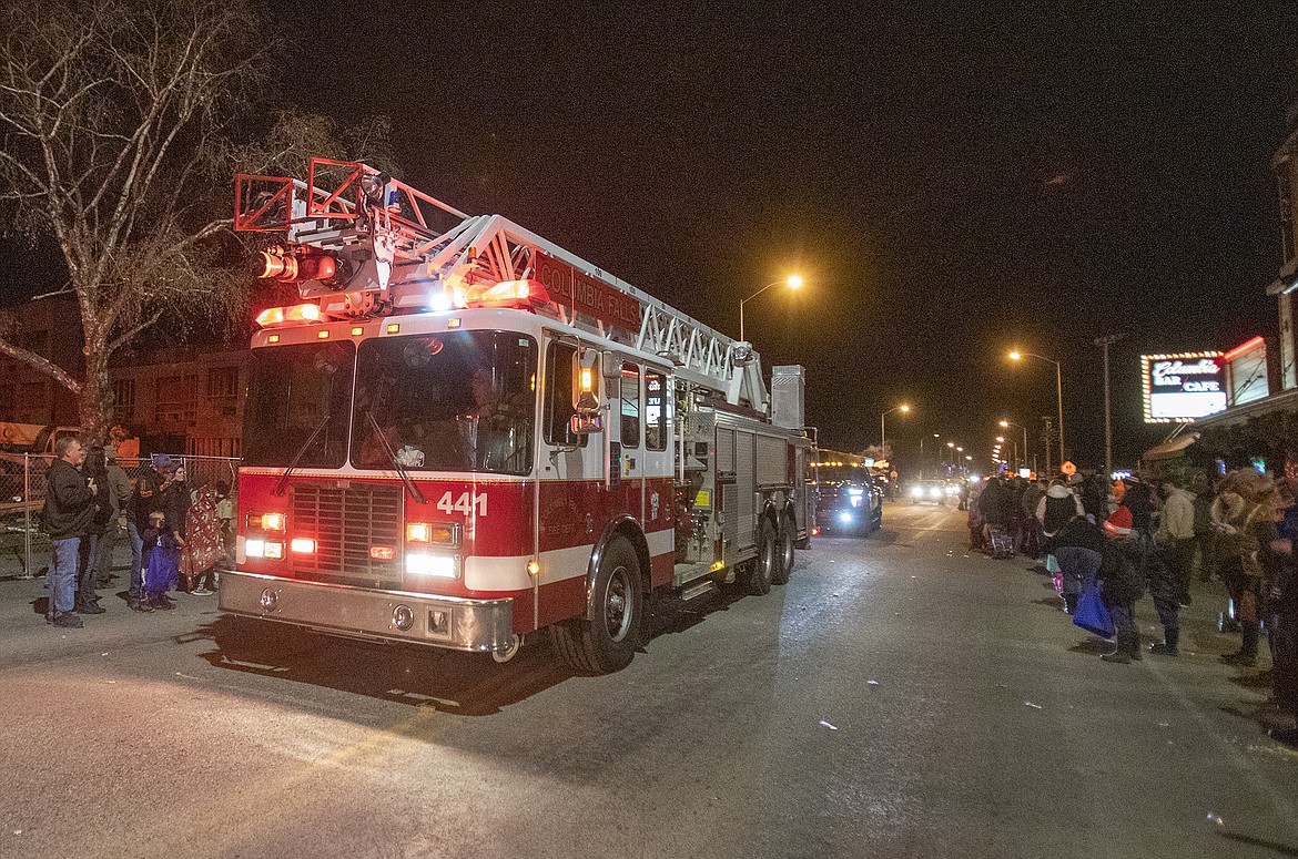 The Columbia Falls ladder truck rides down Nucleus.