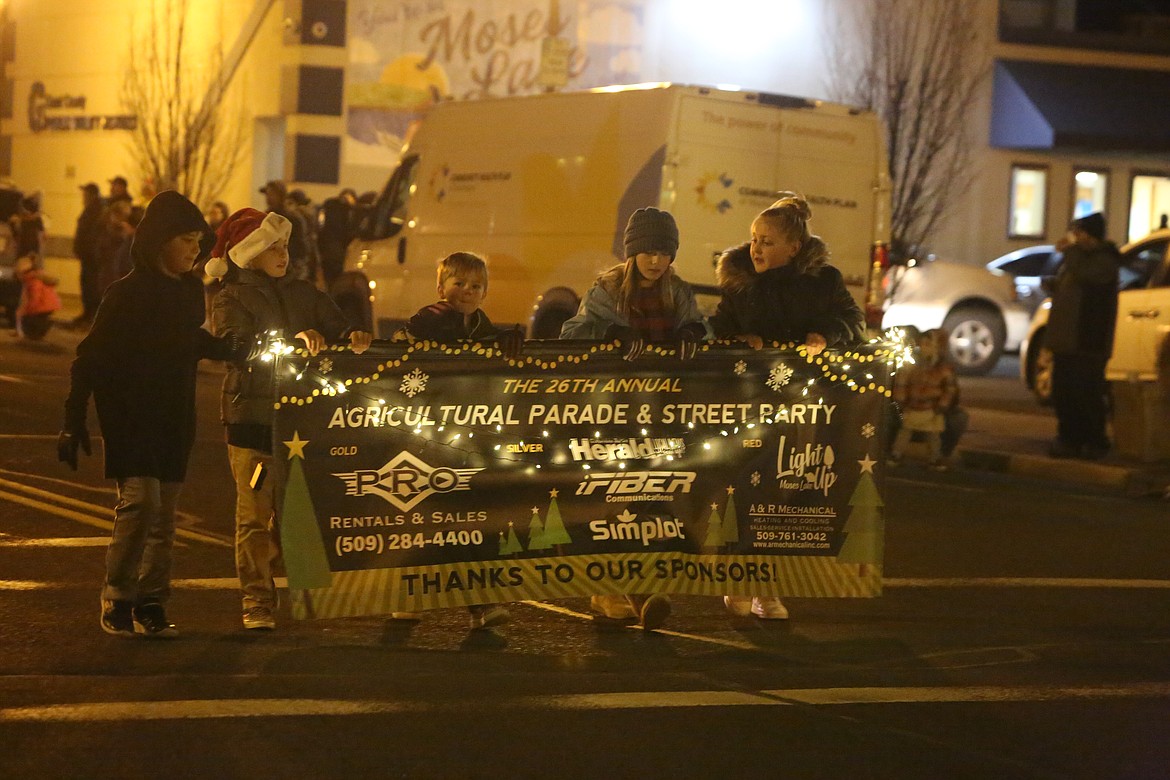 Lights, floats — and farm implements Ag Parade returns to downtown