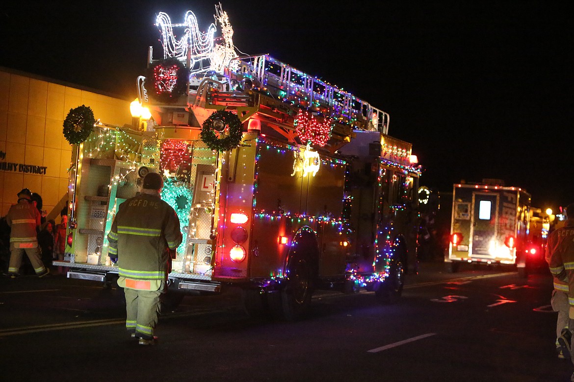 The Moses Lake Fire Department outlined its trucks in lights for the 26th annual Agricultural Parade Friday in Moses Lake.