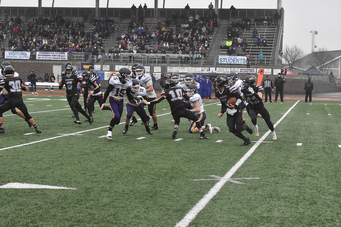 Senior Dane Isaak (5) rushes for Almira/Coulee-Hartline High School Saturday in the 1B Washington Interscholastic Activities Association Gridiron Classic: State Football Finals in Tacoma.
