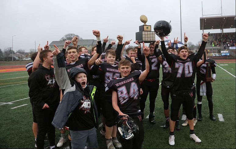 Almira/Coulee-Hartline High School players celebrate their win Saturday in the 1B Washington Interscholastic Activities Association Gridiron Classic: State Football Finals in Tacoma.