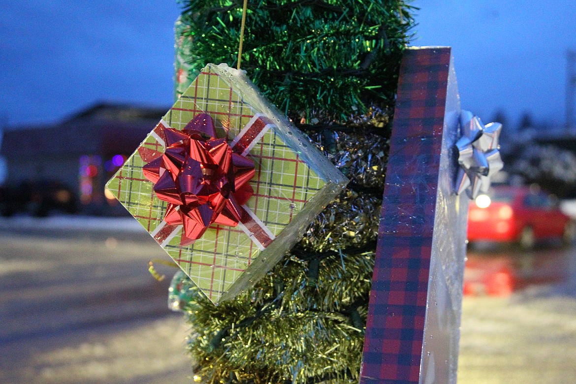 Presents hang from light post on Mineral Avenue Dec. 4. (Will Langhorne/The Western News)