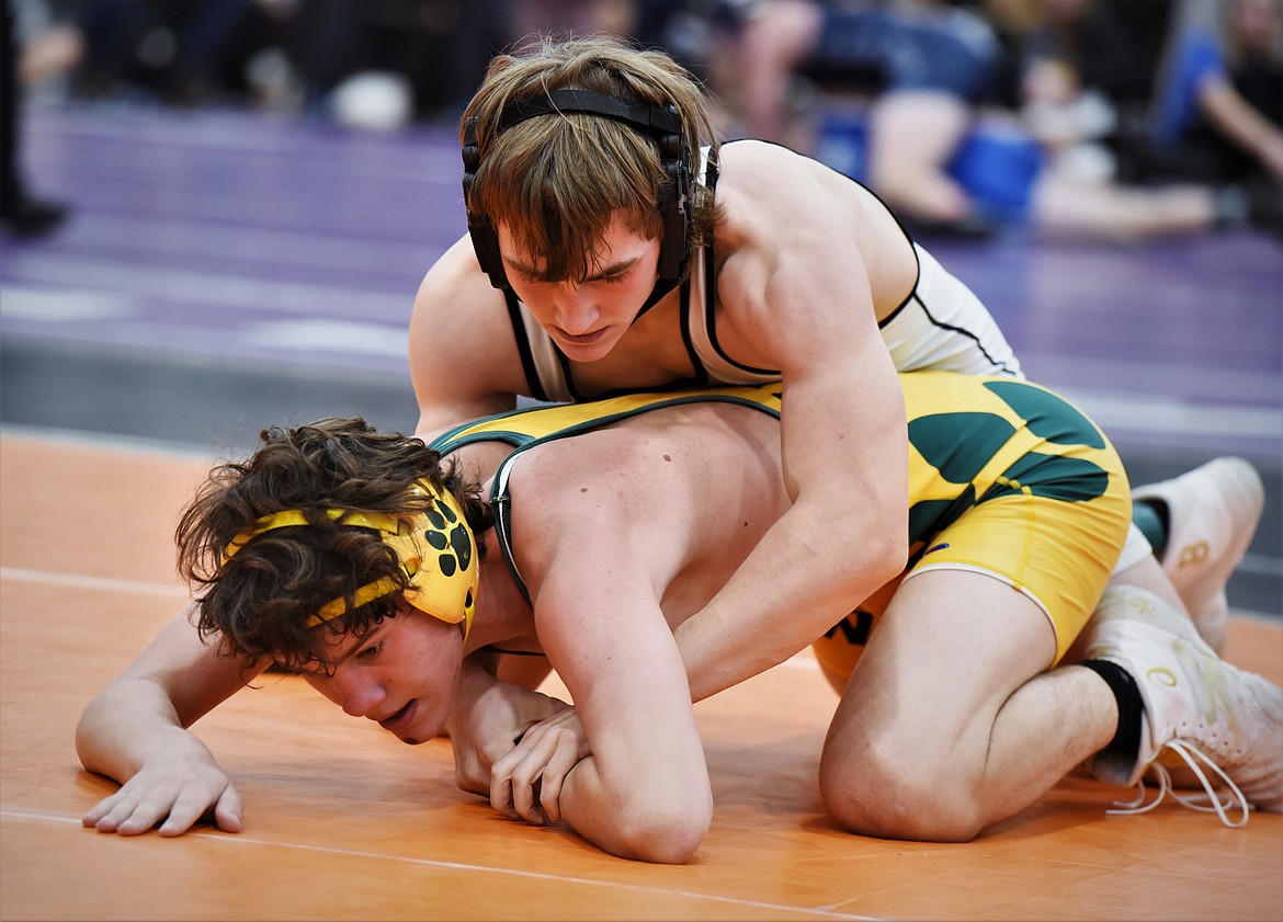 Libby's Connor Benson vs. Whitefish's Caleb Fleming at 138 pounds. (Scot Heisel/Lake County Leader)