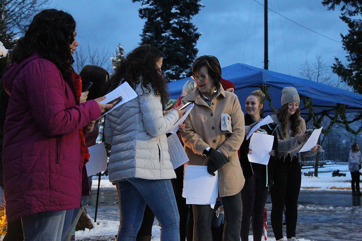 Carolers sing at the Libby Christmas tree lighting on Dec. 4. (Will Langhorne/The Western News)