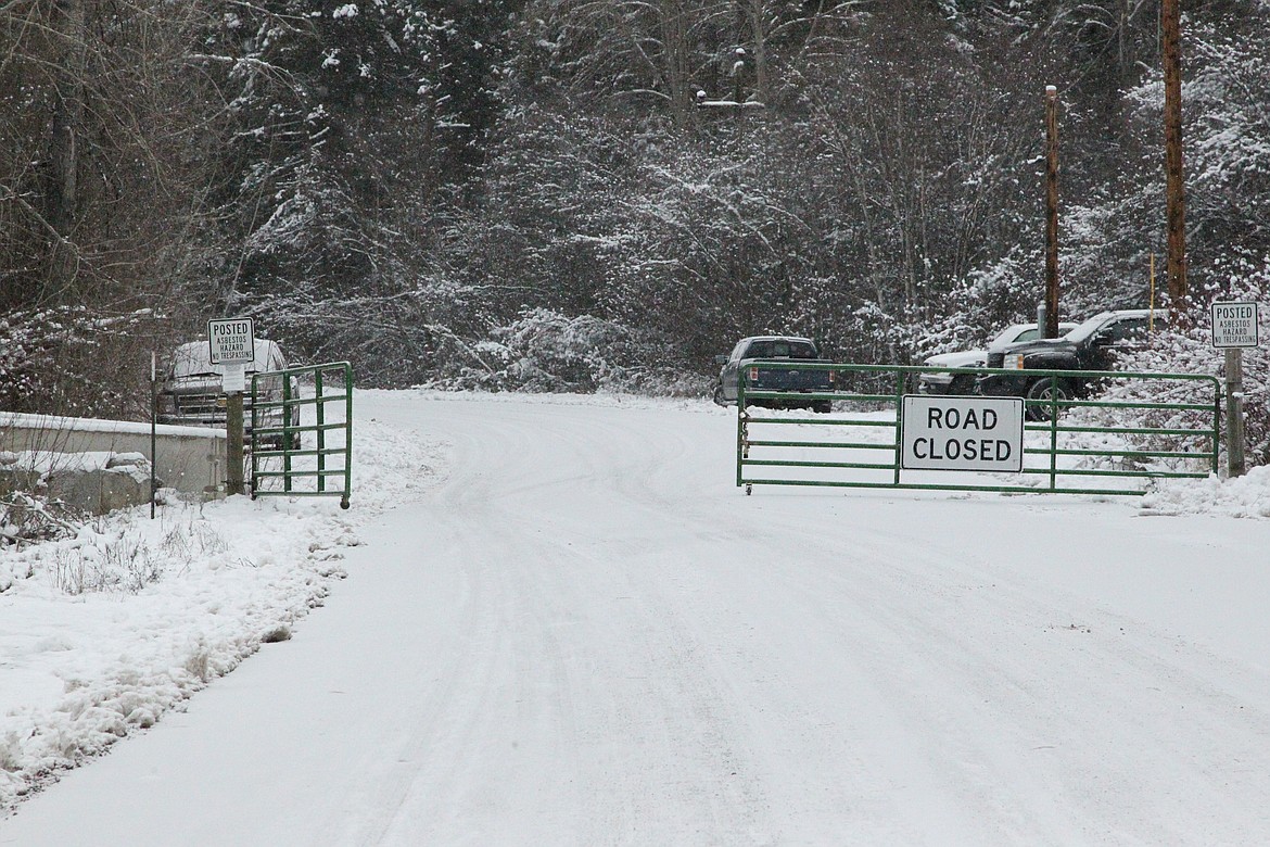 Gate barring passage up Rainy Creek Road to the site of the former W.R. Grace vermiculite mine site on Dec. 6. (Will Langhorne/The Western News)
