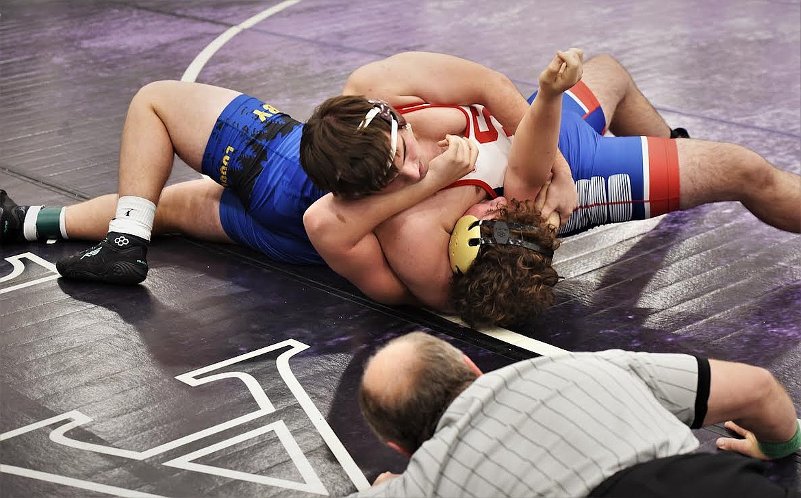 Superior's Carter Woodson wrestles Friday during the Owen Invitational in Polson last weekend. Woodson was one of four Bobcat placewinners. (Scot Heisel/Valley Press)