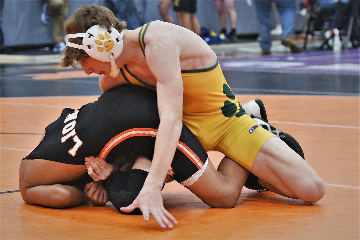 Bulldog freshman Landree Aurund wrestles Eureka's Pancho Ibanez in the 120-pound division at the Owen Invitational in Polson on Friday. (Scot Heisel/Lake County Leader)