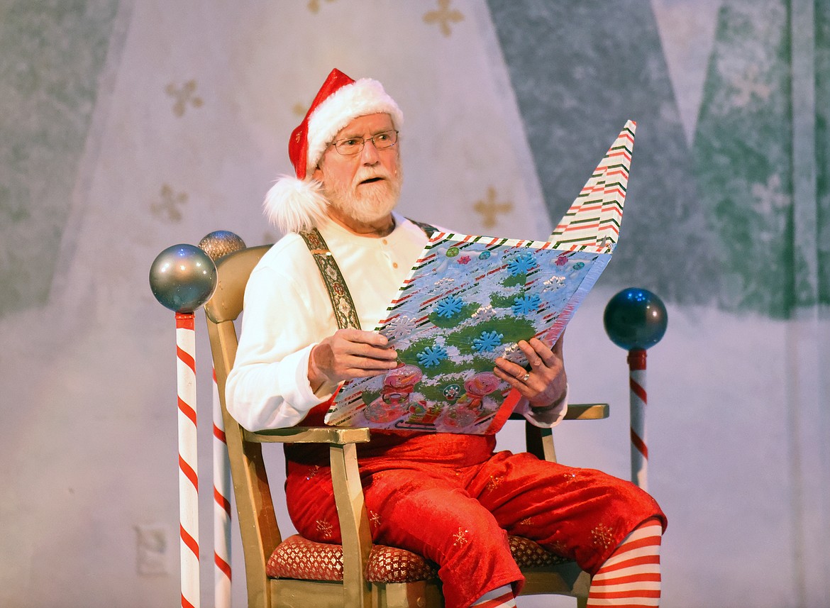 Portraying Santa, Scotty MacLaren, reads the story of Buddy the Elf during one of the opening scenes of the Whitefish Theatre Co.’s production of “Elf the Musical” last week at the O’Shaughnessy Center. (Heidi Desch/Whitefish Pilot)