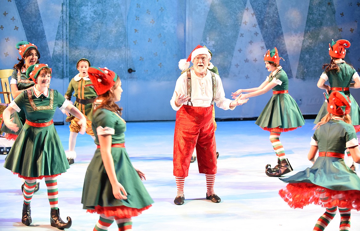 Scotty MacLaren as Santa leads elves at the North Pole in a dance during the Whitefish Theatre Co.’s production of “Elf the Musical” last week at the O’Shaughnessy Center. (Heidi Desch/Whitefish Pilot)