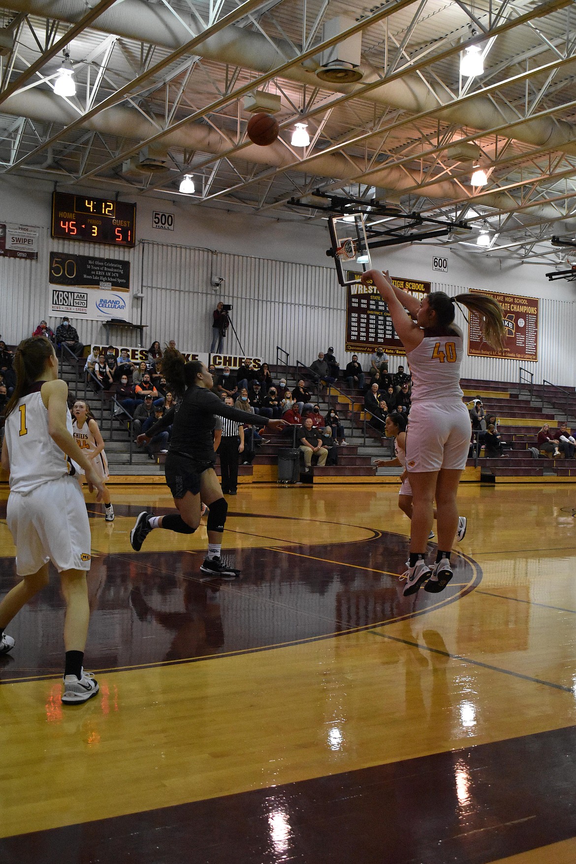 Moses Lake senior Meagan Karstetter (40) shoots for a three-pointer during the first game of the season on Friday against Chiawana High School.