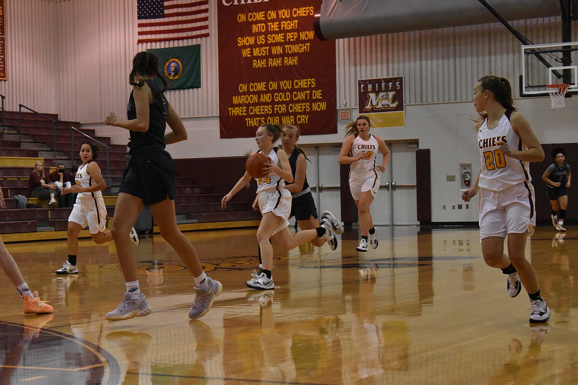 Senior Teagan Wiltbank (24) drives the ball down court Friday. Wiltbank was the high scorer of the game for Moses Lake, with 27 points.