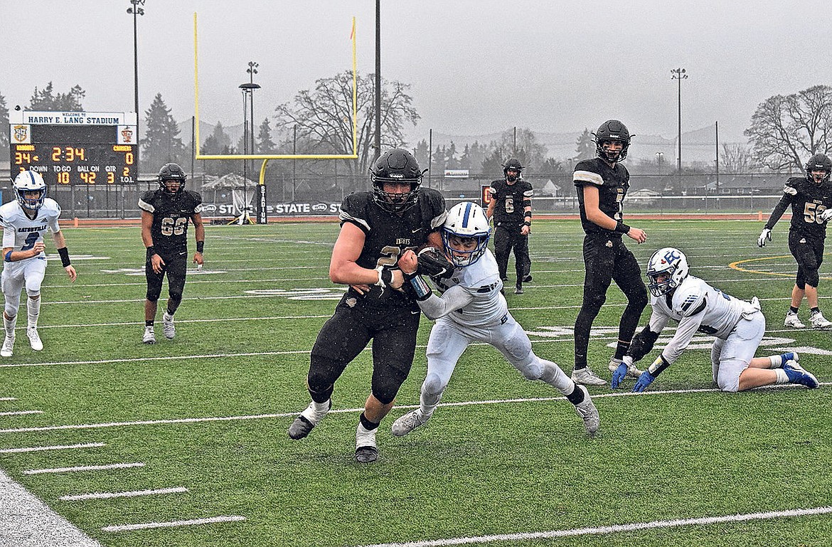 Royal senior Avery Ellis (22) runs with the ball Saturday in the 1A Washington Interscholastic Activities Association Gridiron Classic: State Football Finals against Eatonville High School.