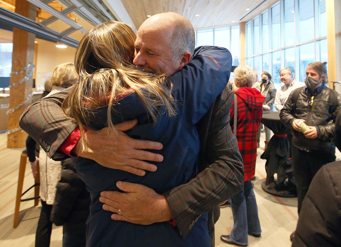 Retiring Vice President for Student Services Graydon Stanley hugs a guest at the going away party for NIC leaders at the Bob and Leona DeArmond Building on Monday. BILL BULEY/Press