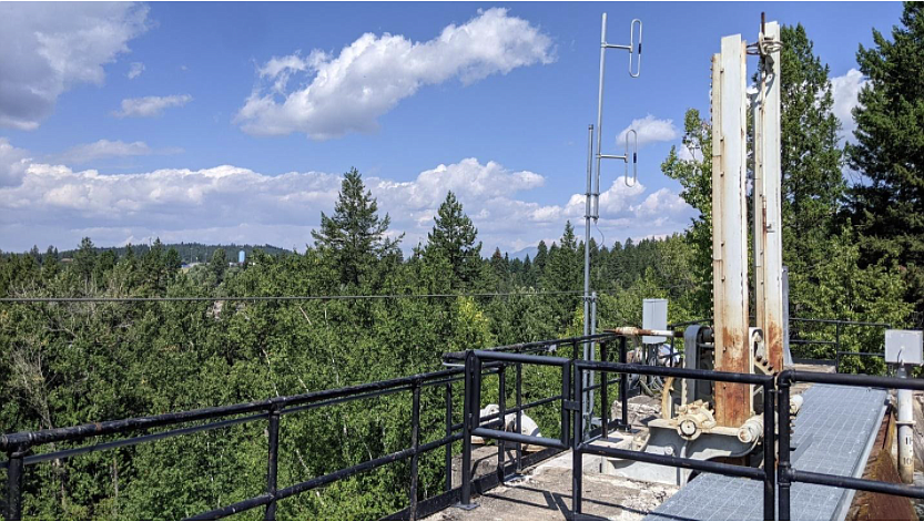 2021 view north from top of penstocks at Bigfork powerhouse. Chapman Hill in far-left background completely covered with trees. Authors Photograph.